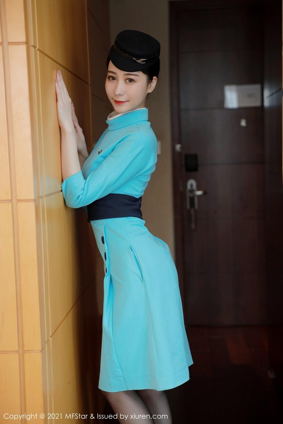 Exclusive Photoshoot: Elegant Flight Attendant Uniform, Black Stockings, and Stunning Curves 68P